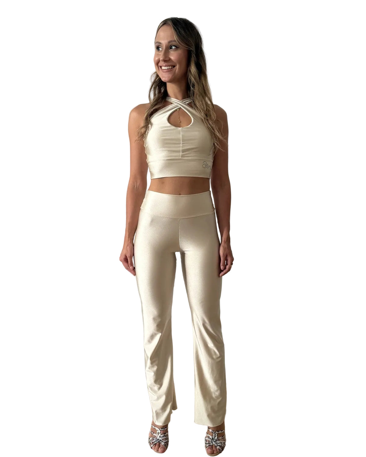 	Woman wearing Ama & Move Adjustable Top Mara and Flared Pants Alba in Creme, smiling, festival dancewear