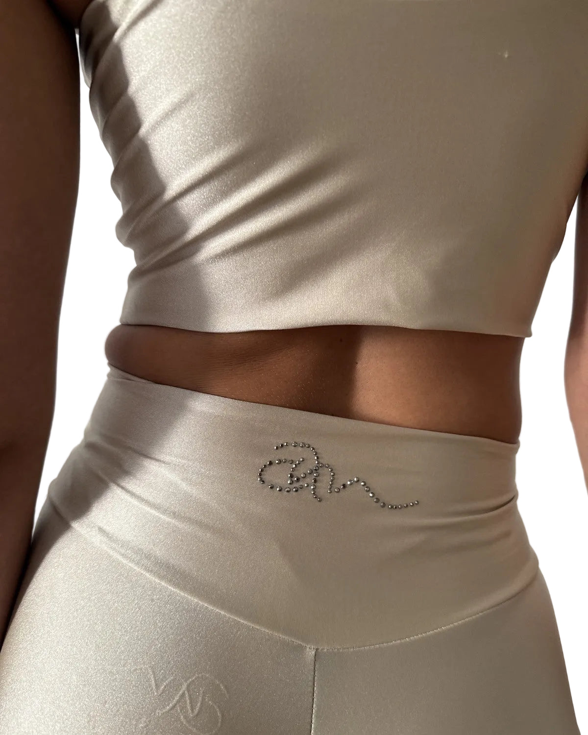 Flared Pants Alba in Creme, waistband detail with Ama & Move crystal logo